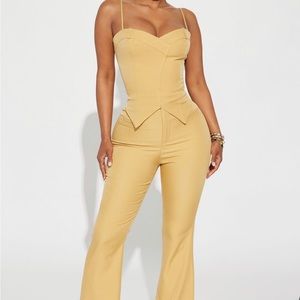 This two piece is in a medium, Mustard colour